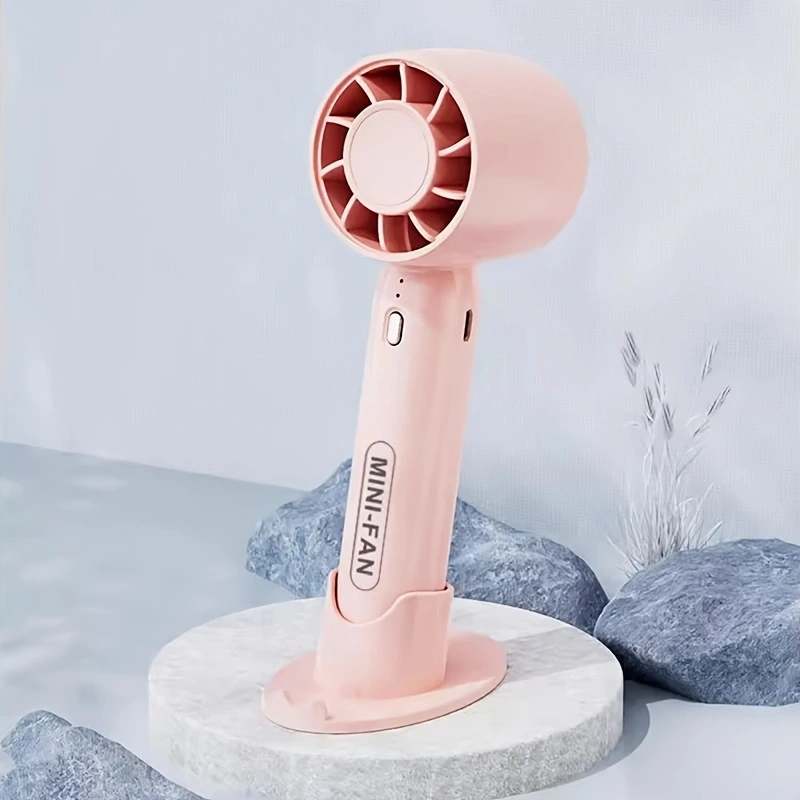 New mini handheld fan, USB rechargeable, comes with a stand for holding your phone.