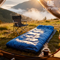 A blue envelope sleeping bag, modular and suitable for camping, hiking, trekking, cycling, travel, and other outdoor activities.
