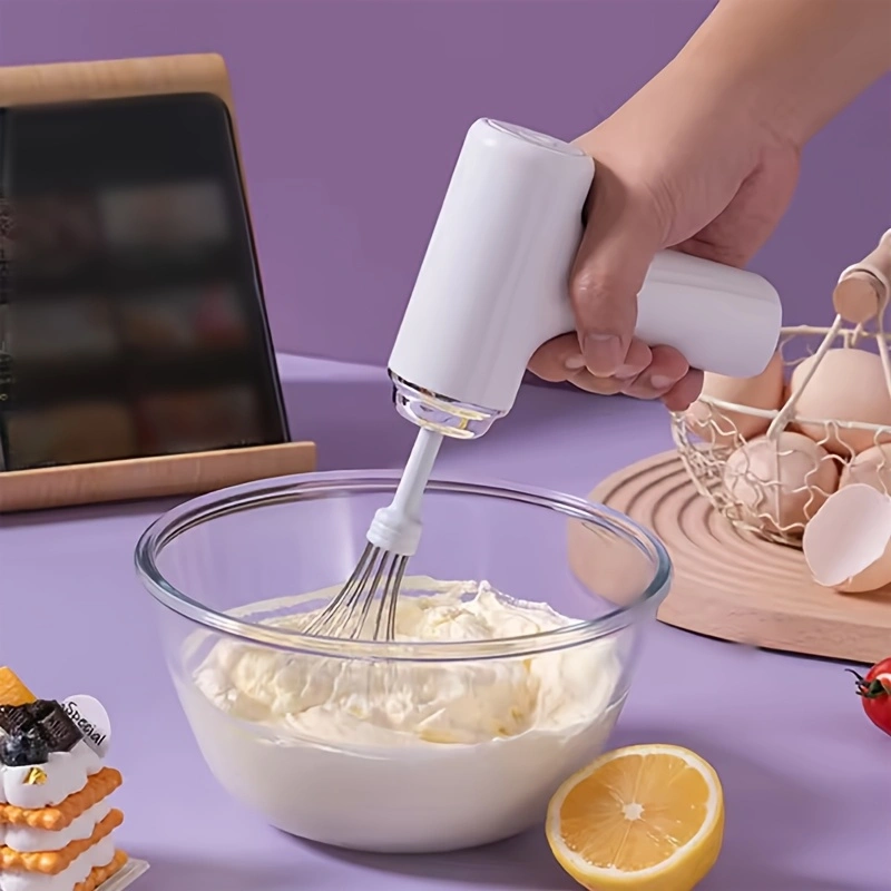 Electric handheld mini mixer with 2 detachable beaters and 3 speed modes.