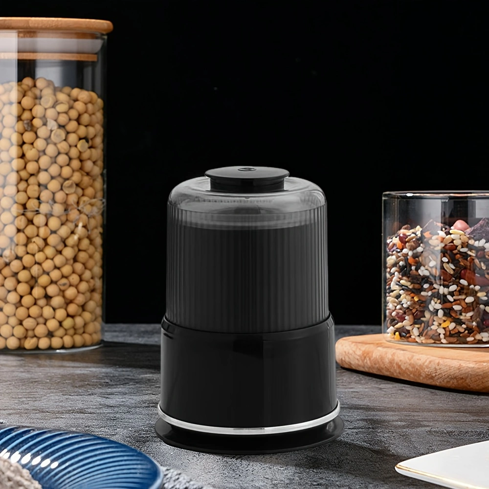Household electric grinder with stainless steel blade, multi-functional grinder for coffee, spices, and nuts.