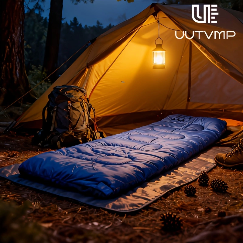 A blue envelope sleeping bag, modular and suitable for camping, hiking, trekking, cycling, travel, and other outdoor activities.