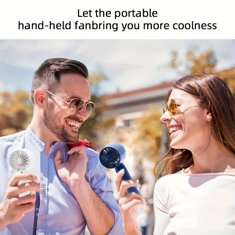 New mini handheld fan, USB rechargeable, comes with a stand for holding your phone.