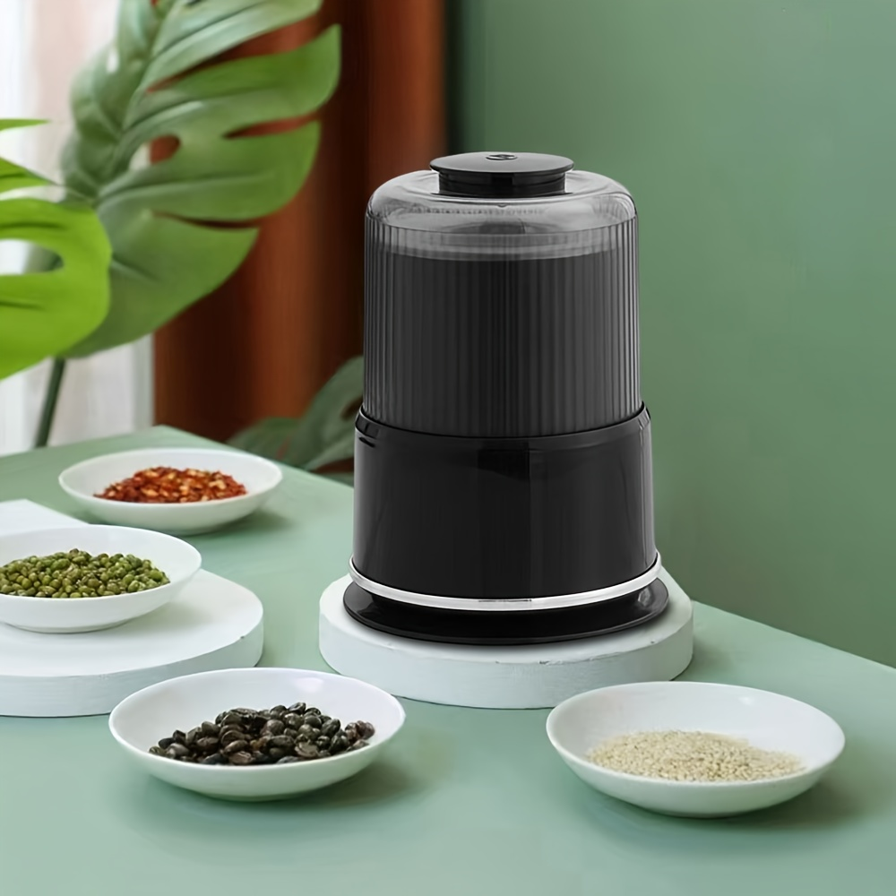 Household electric grinder with stainless steel blade, multi-functional grinder for coffee, spices, and nuts.