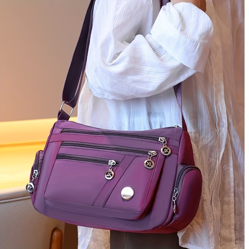 Unisex Casual Crossbody Bag - a Spacious Multi-Pocket Shoulder Bag with Adjustable Straps, Made from Lightweight And Durable Lining. The Black Version Features Tassel Details