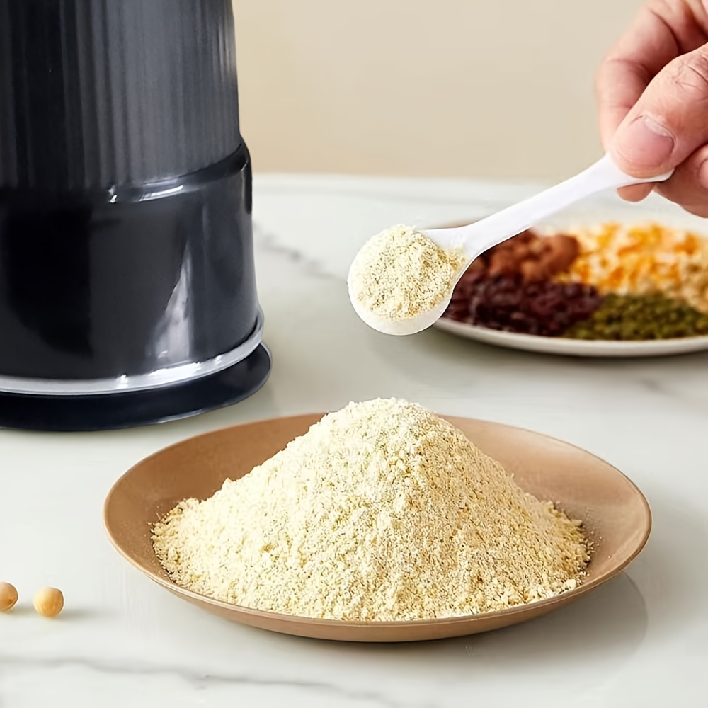 Household electric grinder with stainless steel blade, multi-functional grinder for coffee, spices, and nuts.