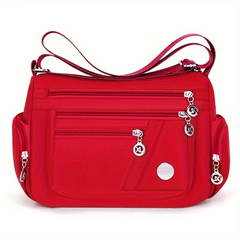 Unisex Casual Crossbody Bag - a Spacious Multi-Pocket Shoulder Bag with Adjustable Straps, Made from Lightweight And Durable Lining. The Black Version Features Tassel Details