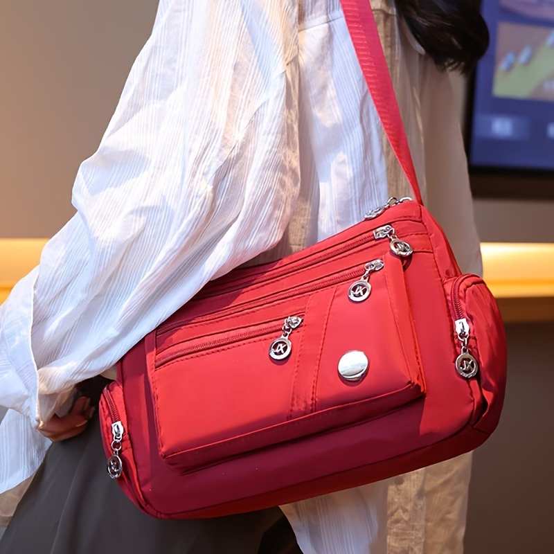 Unisex Casual Crossbody Bag - a Spacious Multi-Pocket Shoulder Bag with Adjustable Straps, Made from Lightweight And Durable Lining. The Black Version Features Tassel Details