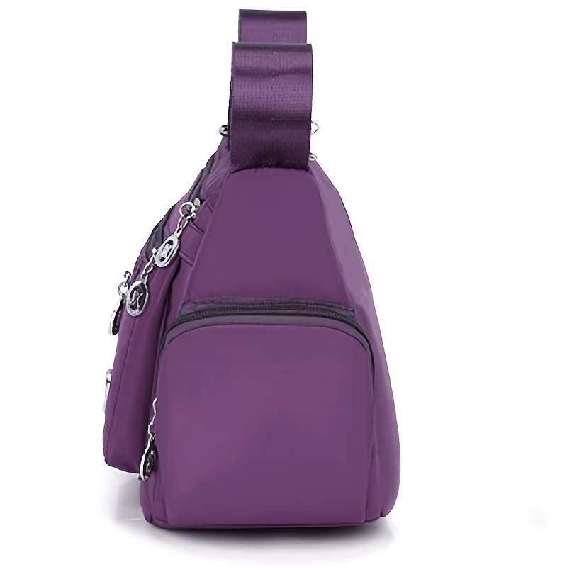 Unisex Casual Crossbody Bag - a Spacious Multi-Pocket Shoulder Bag with Adjustable Straps, Made from Lightweight And Durable Lining. The Black Version Features Tassel Details