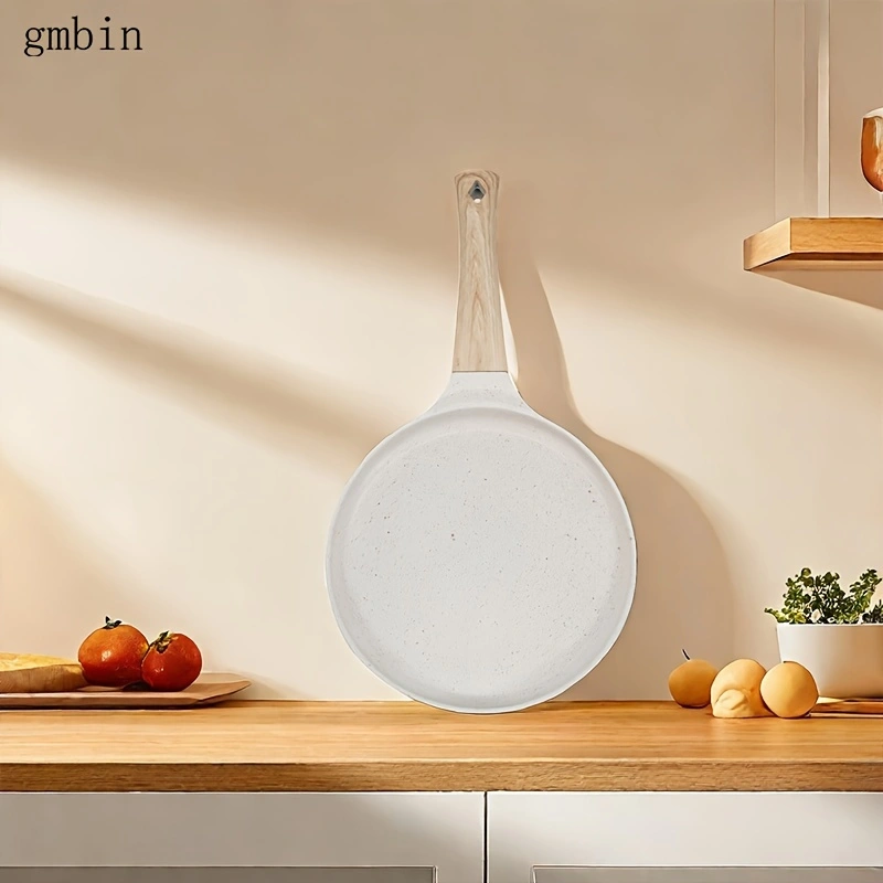 Non-stick crepe frying pan, suitable for crepes, tortillas, and risotto - induction cooker compatible. Features a non-stick coating on the bottom for even heat distribution and easy cleaning.