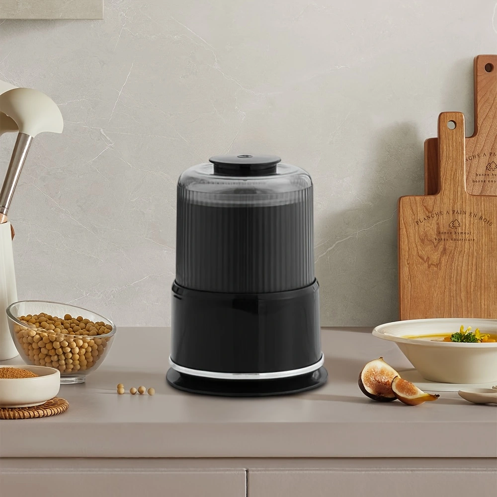 Household electric grinder with stainless steel blade, multi-functional grinder for coffee, spices, and nuts.